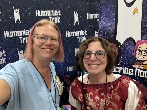 Sarah in Tantalus Penal Colony jumpsuits with a convention guest.