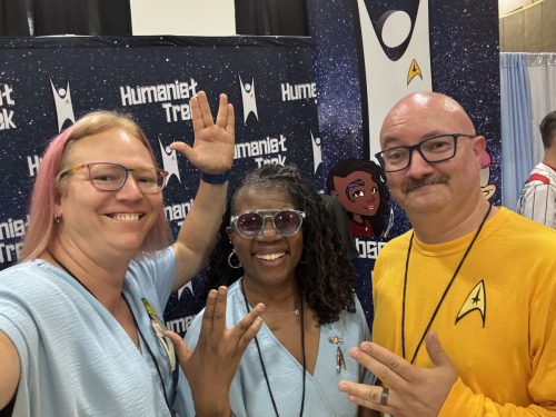 Sarah and Allie in Tantalus Penal Colony jumpsuits with a convention guest in gold TOS uniform.