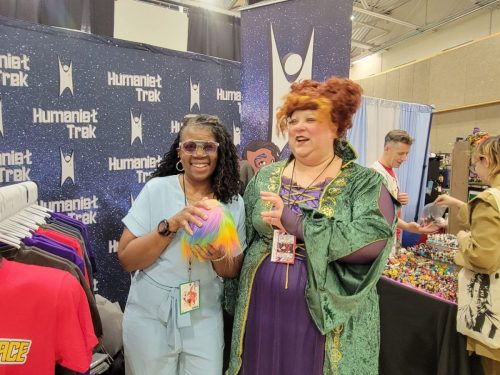 Allie in Tantalus Penal Colony jumpsuits with a convention guest cosplaying as ‘Winnie’ Sanderson from Hocus Pocus.